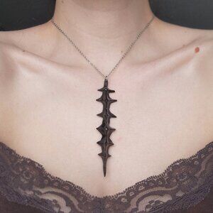 Gothic unique black spiky vertebrae necklace with a small silver chain